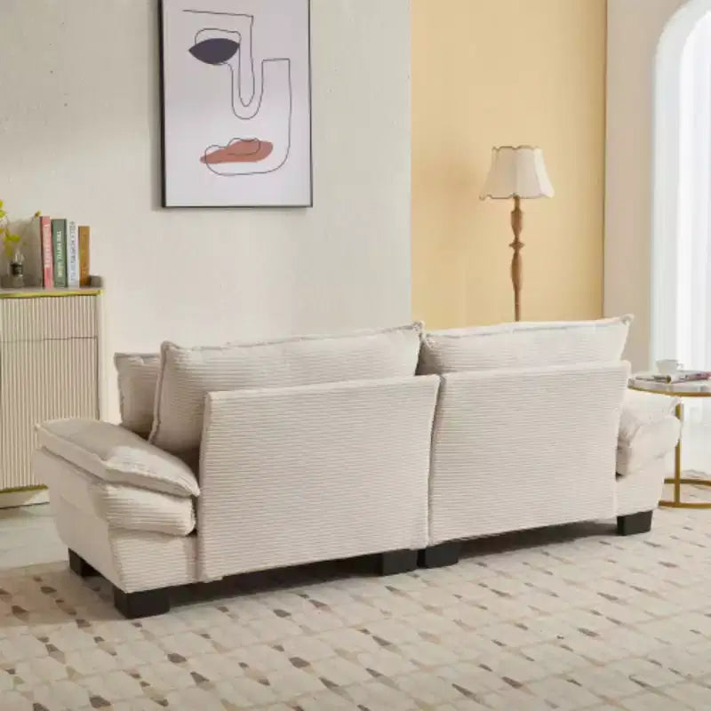 Elegante sofá de pana con asiento profundo: tamaño loveseat con almohadas y función de sofá cama