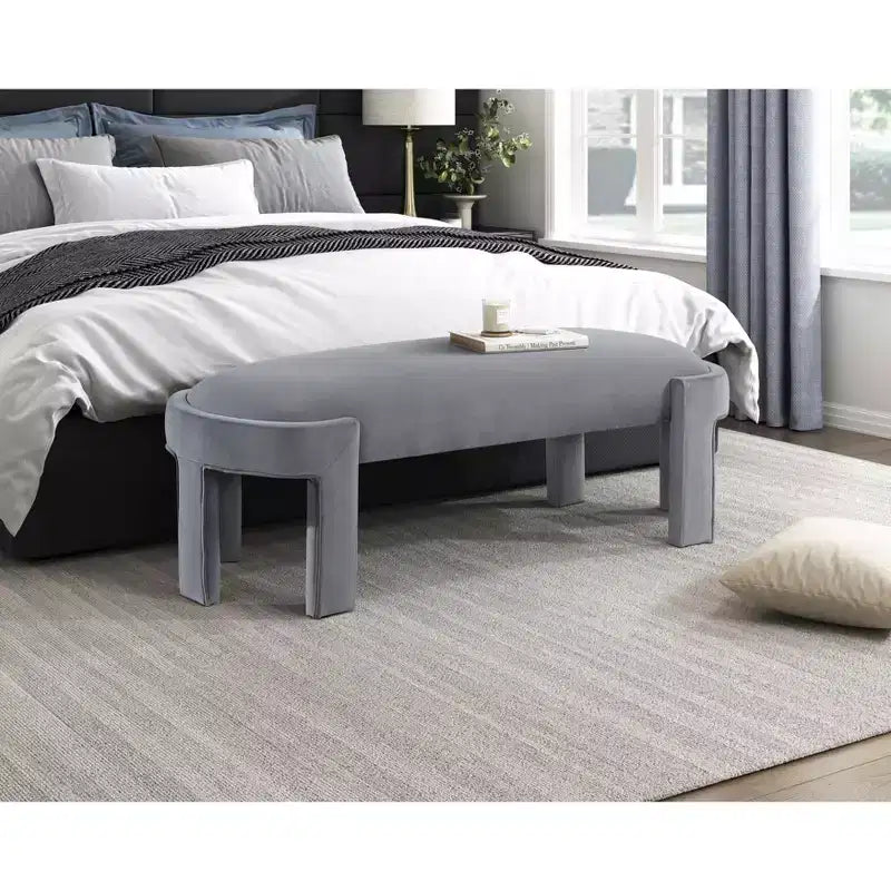 Banco tapizado de tela de terciopelo moderno y elegante Okak con estructura de madera contrachapada, otomana ovalada de lujo cómoda para dormitorio, recibidor
