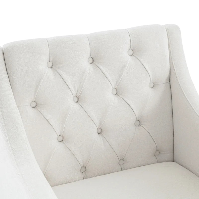 Sillón decorativo tapizado en beige con botones y cojín lumbar