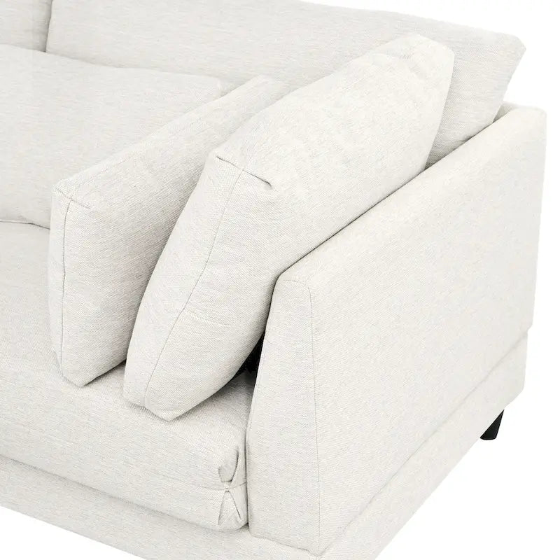 Sofá modular seccional con otomana y almohadas