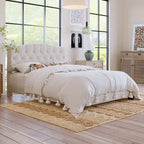 Base de cama tapizada con plataforma, cabecero curvo tipo silla de montar y detalles de rombos capitoné