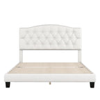 Base de cama tapizada con plataforma, cabecero curvo tipo silla de montar y detalles de rombos capitoné