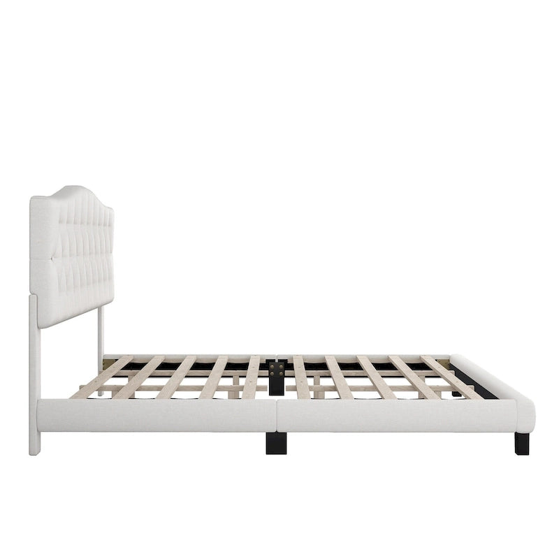 Base de cama tapizada con plataforma, cabecero curvo tipo silla de montar y detalles de rombos capitoné