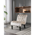 Sillón decorativo de terciopelo beige con capitoné y patas de madera