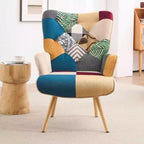 Sillón y mecedora tapizados Peace Nest con respaldo alto y patas y balancines de madera de caucho