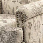 Yahweh Sillón tapizado de madera de transición con diseño de patrón floral, brazos con panel y respaldo de camello | ART OF LIVING DESIGNS